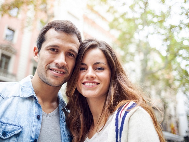 Portrait of happy Hispanic couple (Barcelona, Spain).